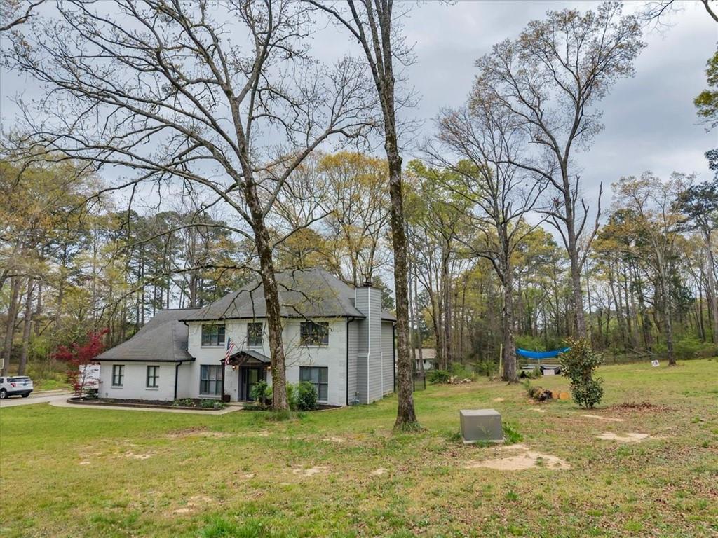 3410 Pilot Road Covington, GA 30014 - Photo 47 of 66 a view of a town with large trees and a small yard