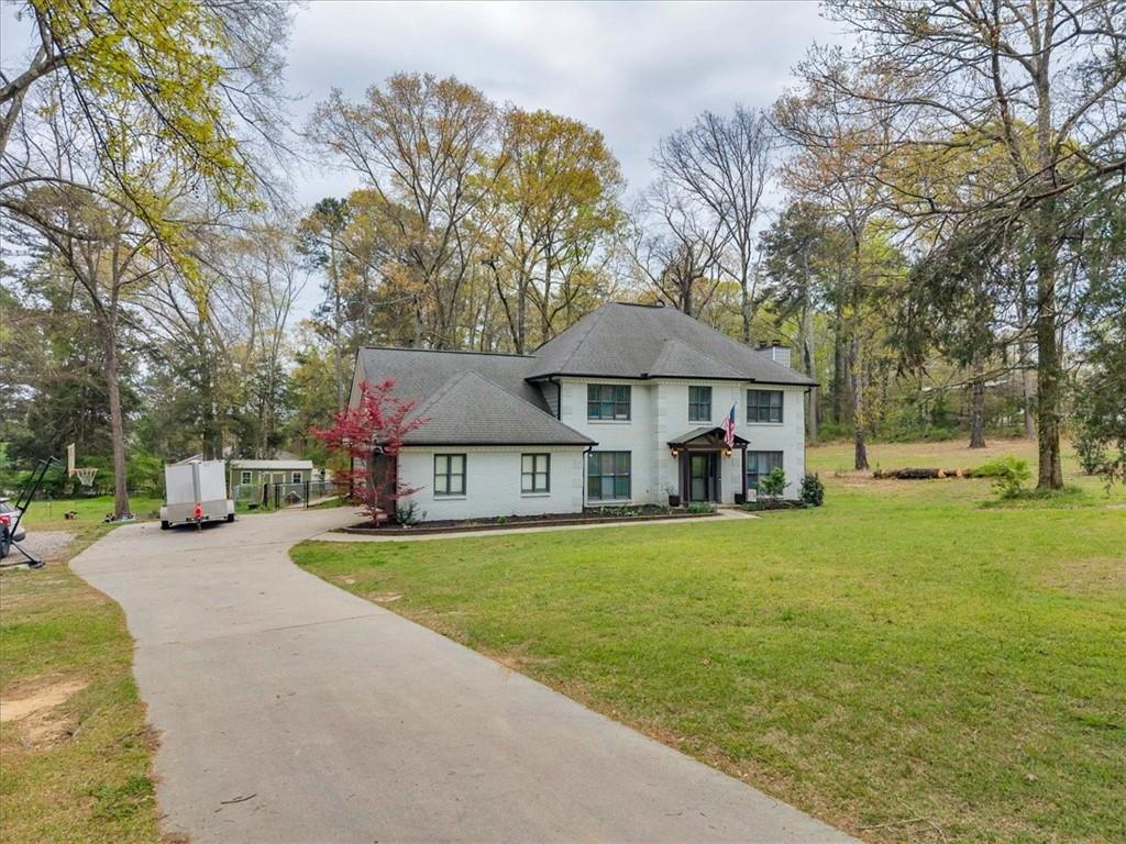 3410 Pilot Road Covington, GA 30014 - Photo 49 of 66 a front view of a house with garden