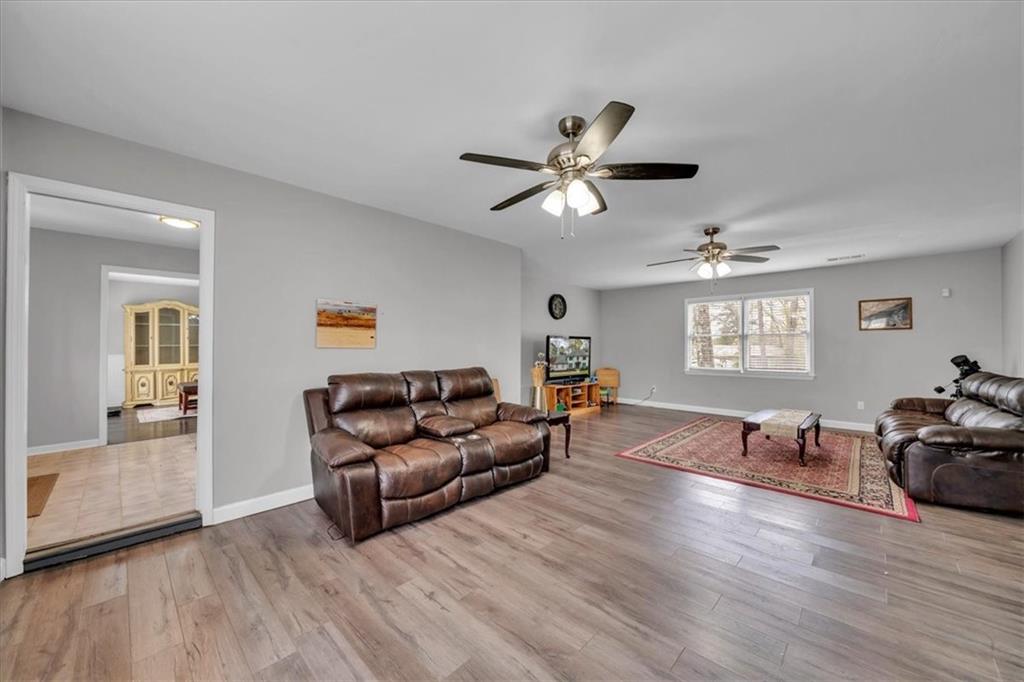 3410 Pilot Road Covington, GA 30014 - Photo 6 of 66 a living room with furniture window and wooden floor