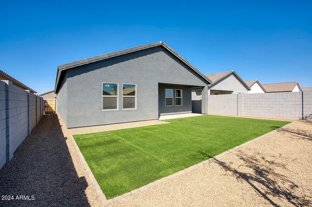 a view of a backyard of the house