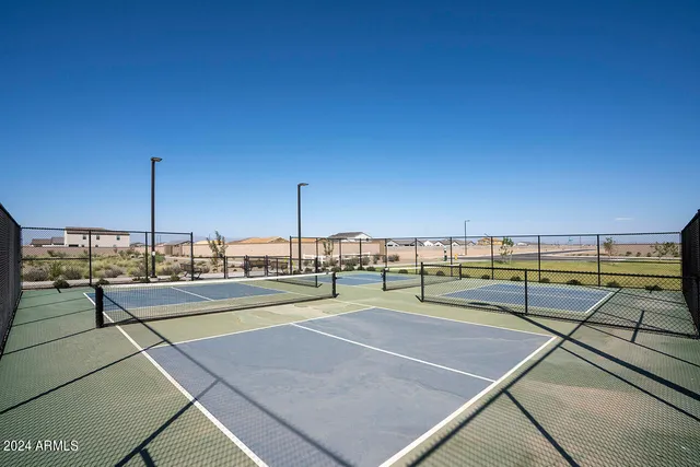 a view of an outdoor space and tennis court