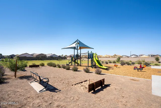 a view of a lake with a yard and mountain view