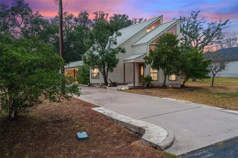a view of house with outdoor space and street view