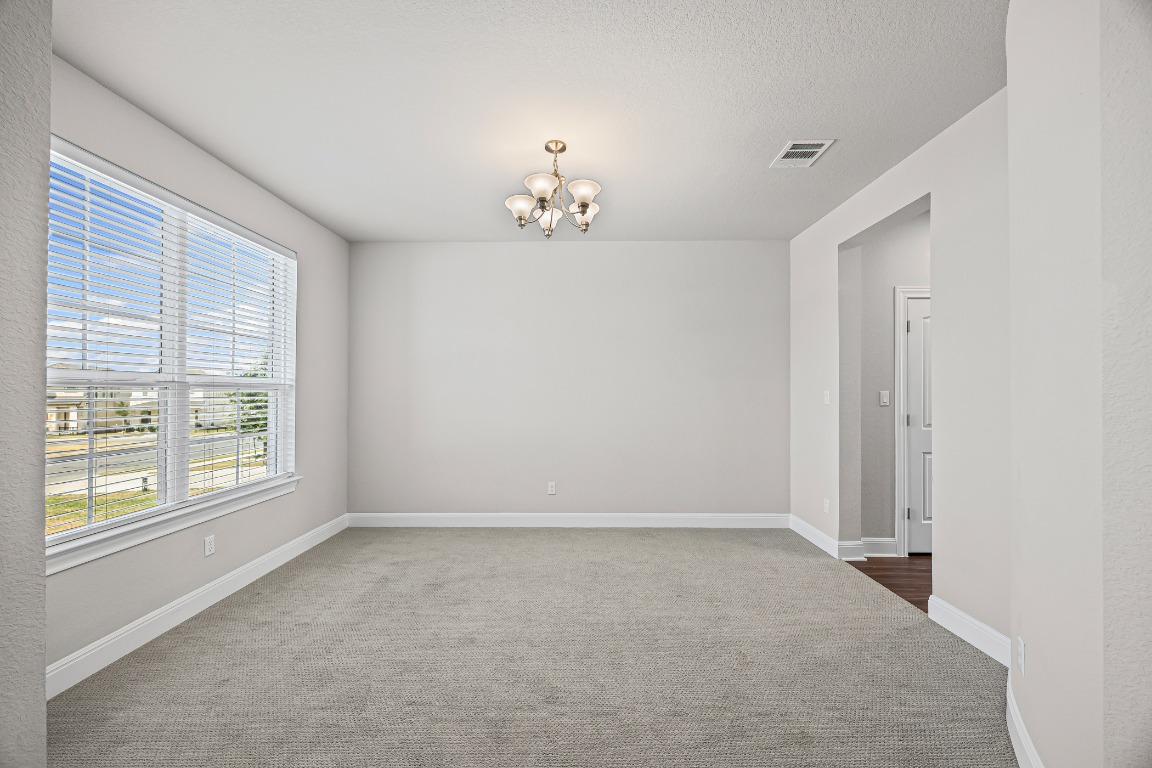 187 Glass Mountain Way Dripping Springs, TX 78620 - Photo 11 of 35 an empty room with a window