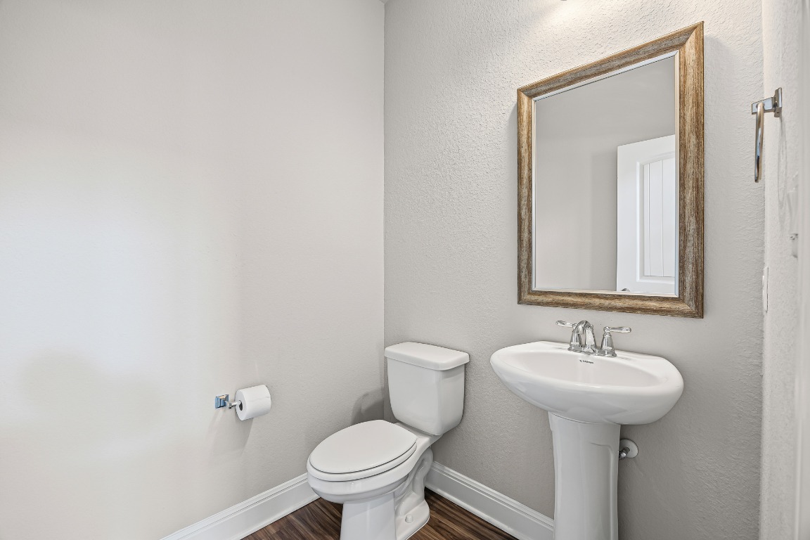 187 Glass Mountain Way Dripping Springs, TX 78620 - Photo 13 of 35 a bathroom with a sink toilet and mirror