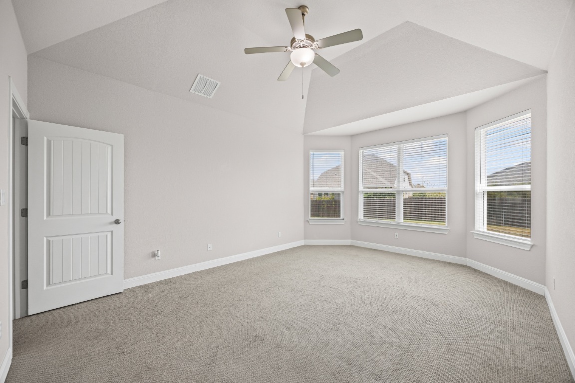 187 Glass Mountain Way Dripping Springs, TX 78620 - Photo 15 of 35 a view of an empty room with a window