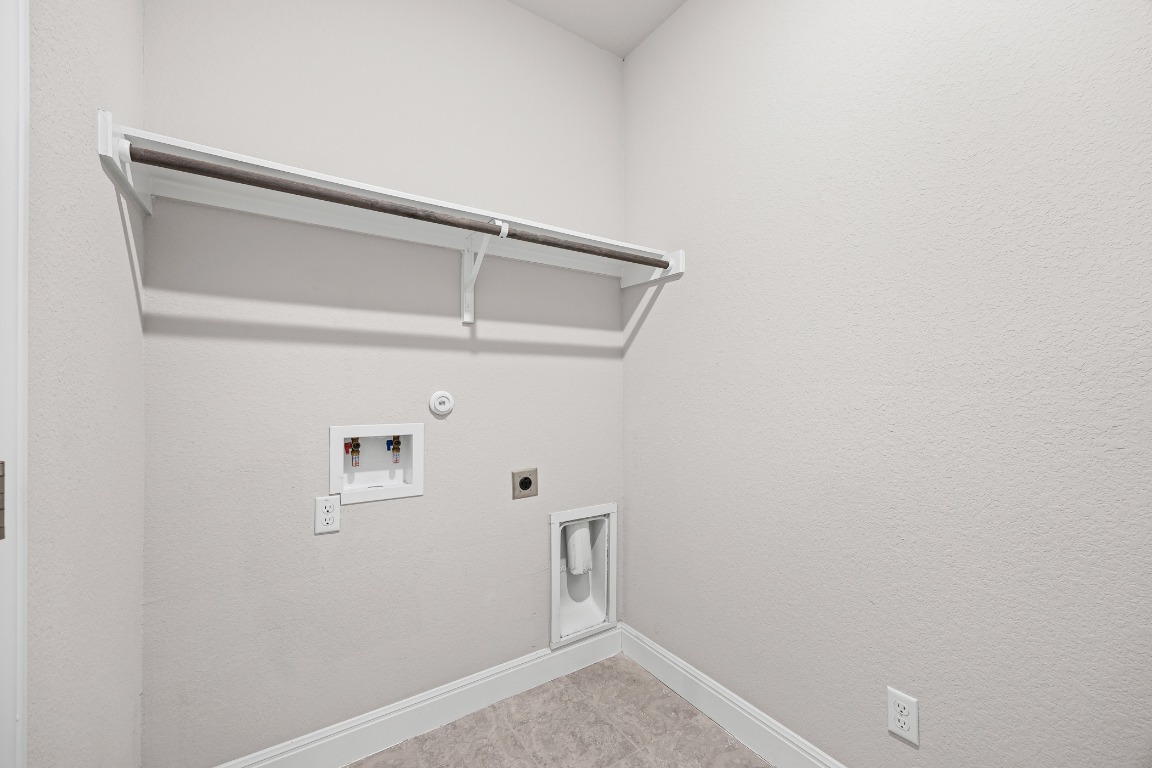 187 Glass Mountain Way Dripping Springs, TX 78620 - Photo 19 of 35 a view of walk in closet with empty racks