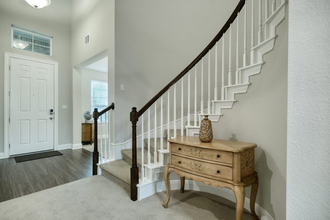 187 Glass Mountain Way Dripping Springs, TX 78620 - Photo 31 of 35 a view of entryway with wooden floor and stairs