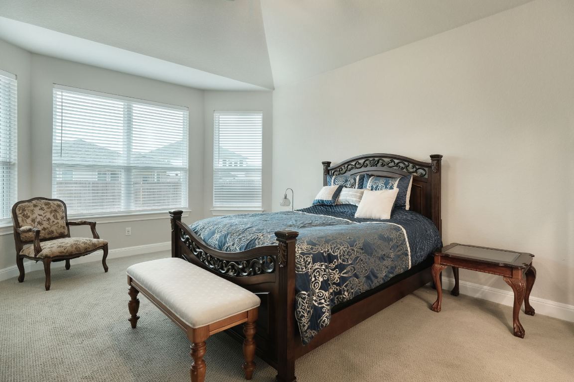 187 Glass Mountain Way Dripping Springs, TX 78620 - Photo 33 of 35 a bedroom with two beds and a window