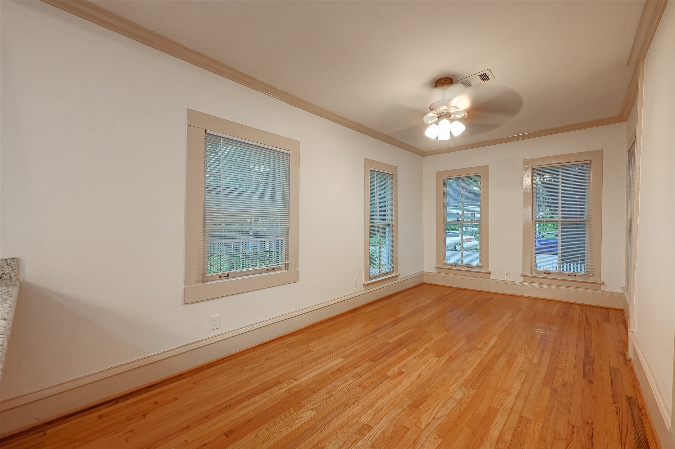 2009 State Street Houston, TX 77007 - Photo 11 of 42 View of the main living area from the kitchen area. the pane widows let in a glorious amount of natural light.