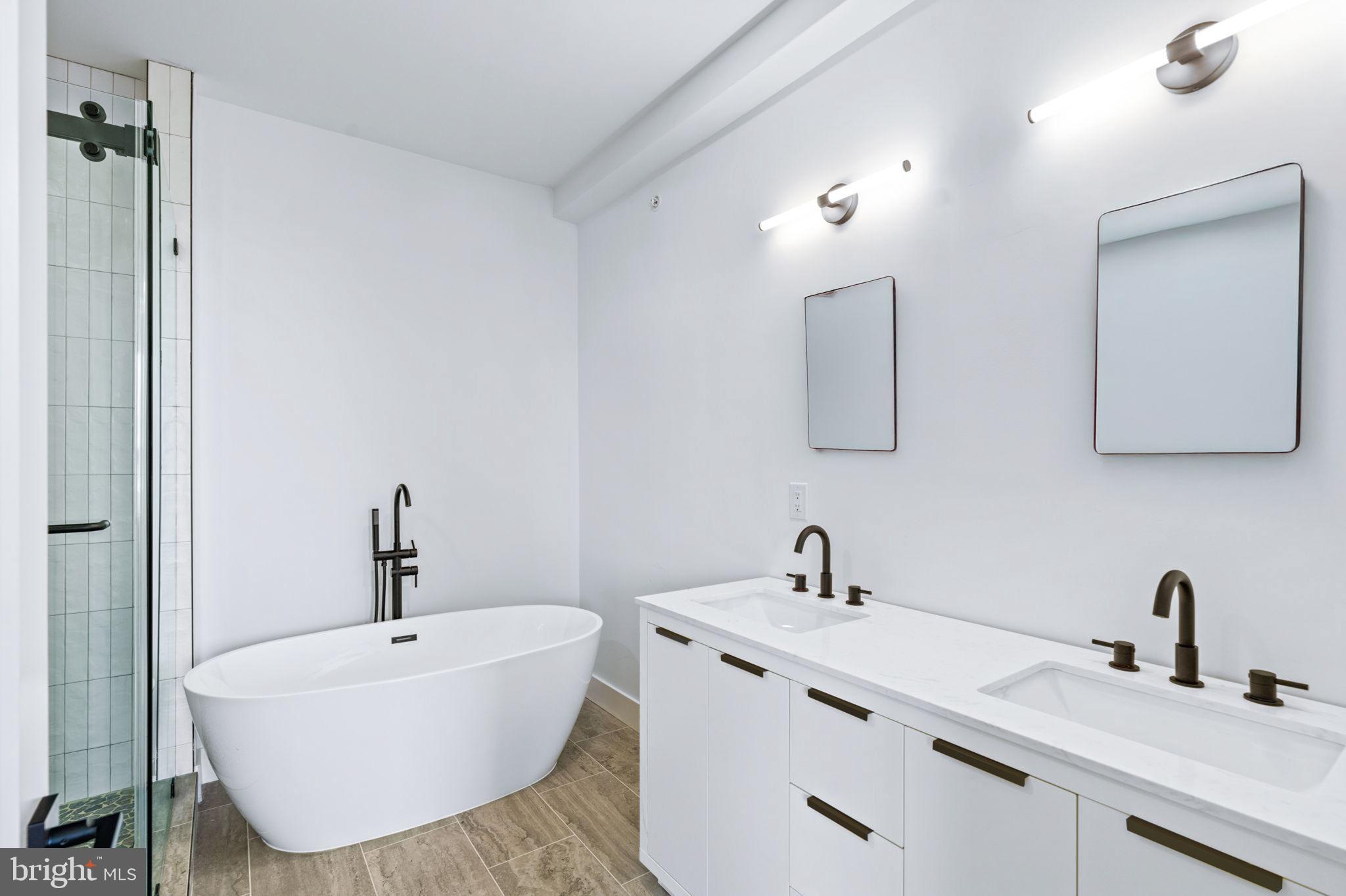 681 Provident Road Southampton, PA 18966 - Photo 20 of 33 a bathroom with a double vanity sink mirror and bathtub