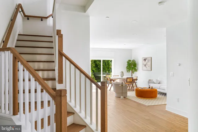 a view of a livingroom with furniture and staircase