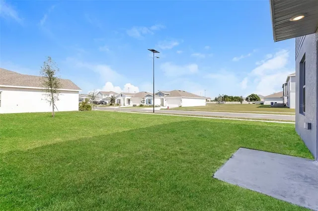 a view of a golf course with a lake