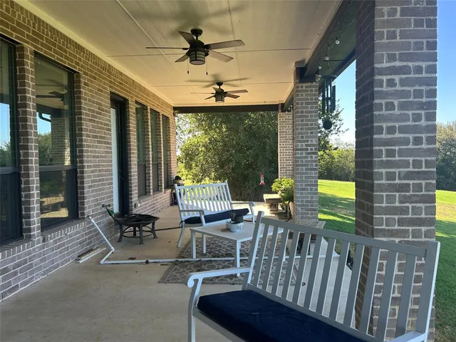 a view of a grassy field with an trees