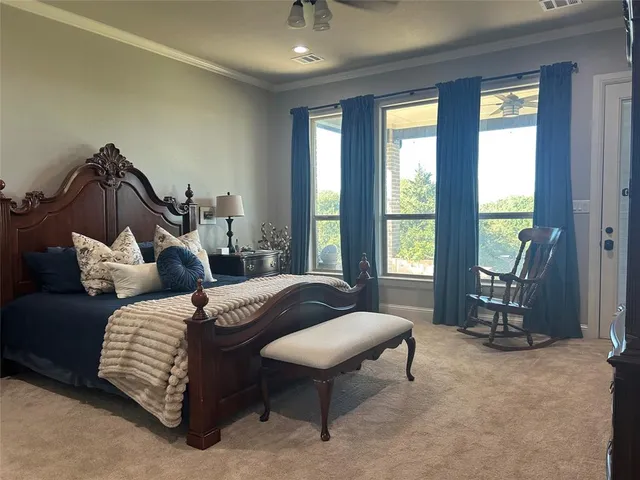 a bedroom with bed and a window