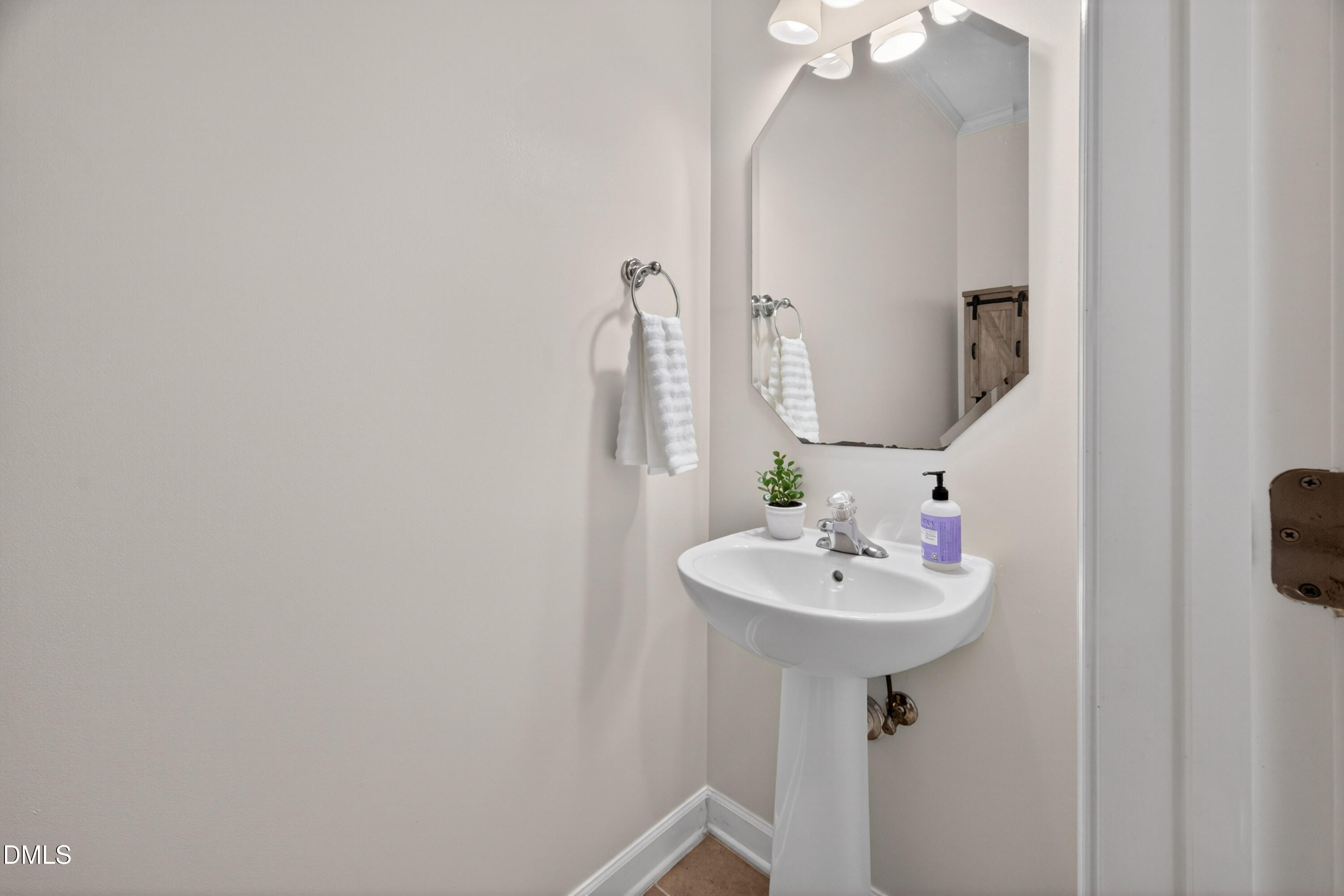5304 Stone Station Drive Raleigh, NC 27616 - Photo 12 of 34 a bathroom with a sink and a mirror