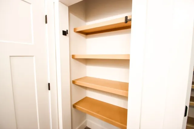 a view of an empty room with a window