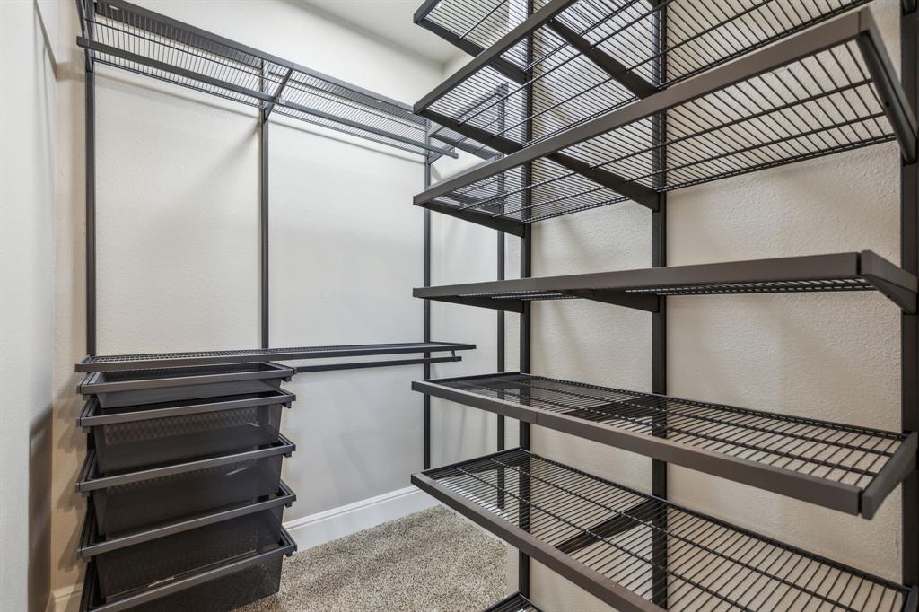 700 Brown Road Palo Pinto, TX 76484 - Photo 25 of 40 Primary bedroom walk in closet with organization