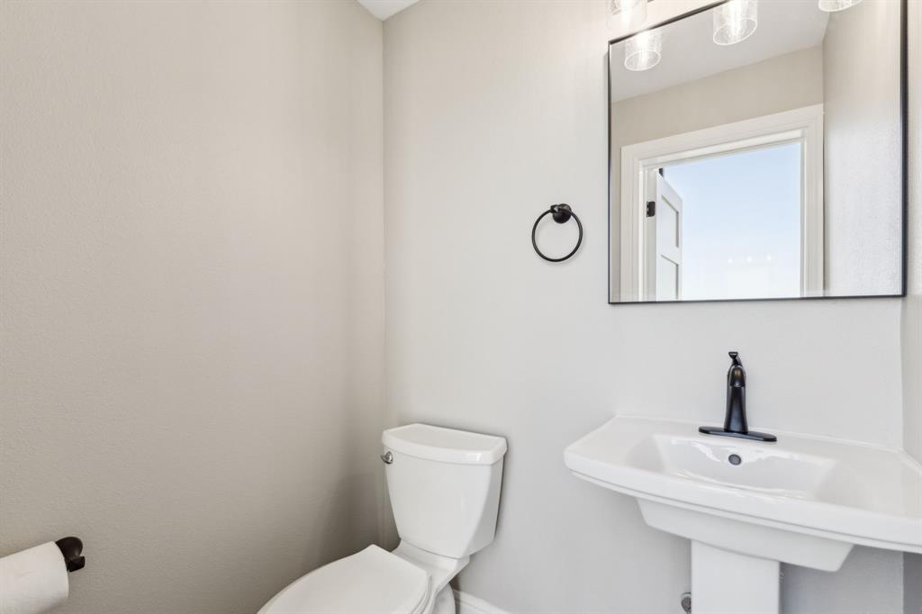 700 Brown Road Palo Pinto, TX 76484 - Photo 30 of 40 Bathroom with toilet and a sink