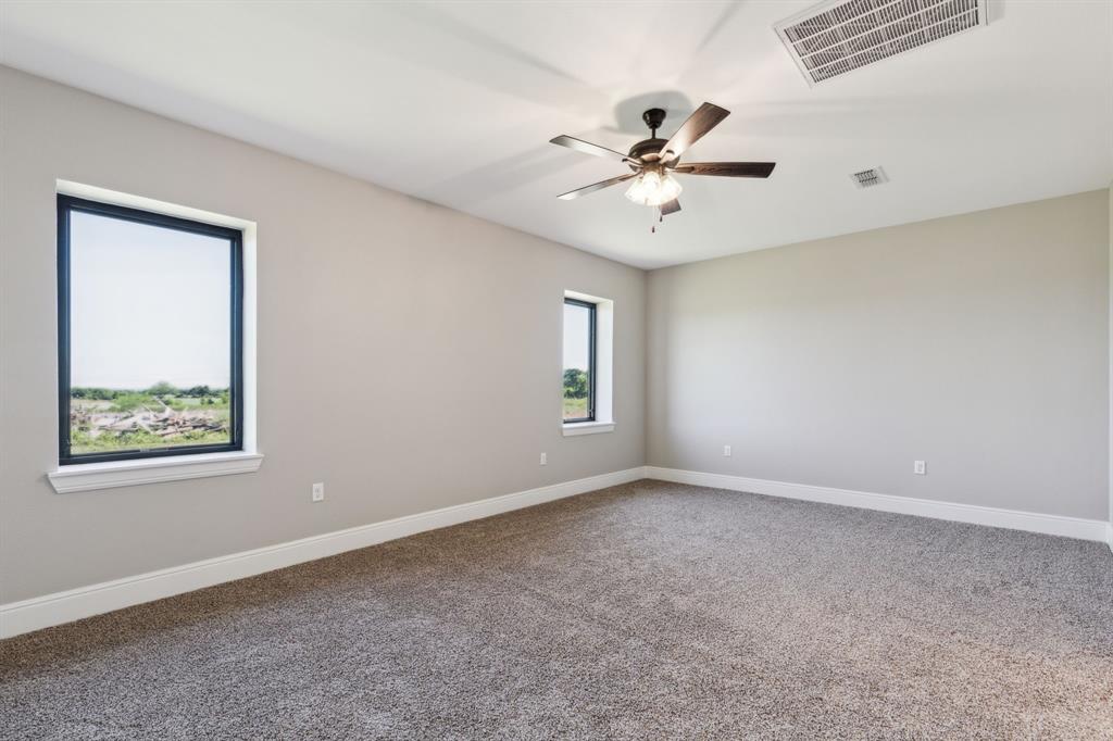 700 Brown Road Palo Pinto, TX 76484 - Photo 31 of 40 Bedroom with carpet, baseboards, and ceiling fan