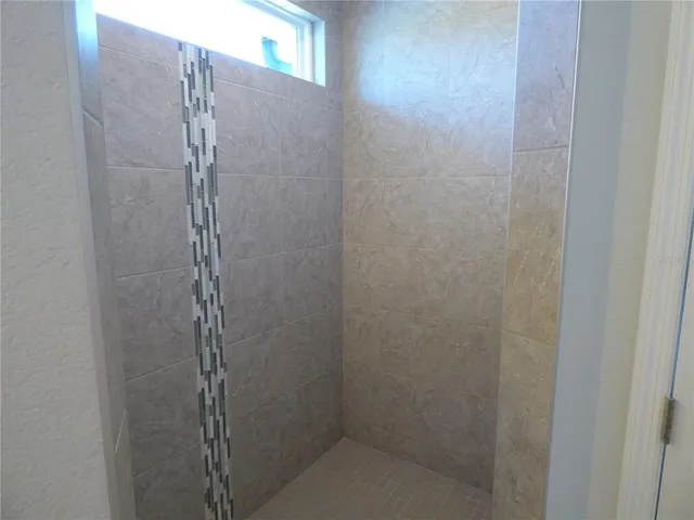 a close up of a utility room with dryer and washer