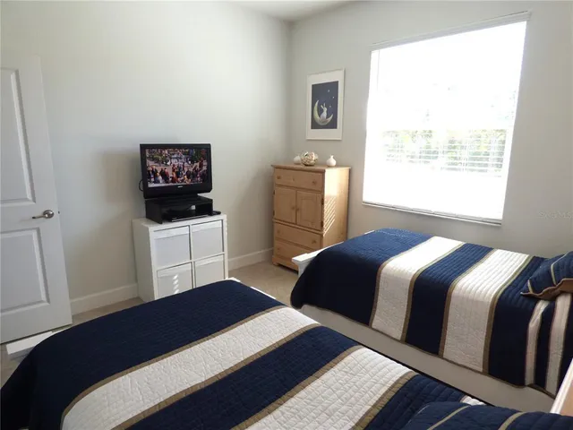 a bathroom with a granite countertop toilet sink and a bathtub