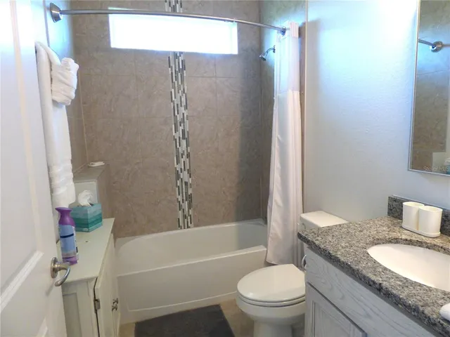 a bedroom with a bed and a desk