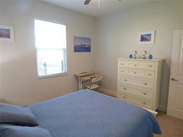 a view of a patio with a table chairs and a fire pit