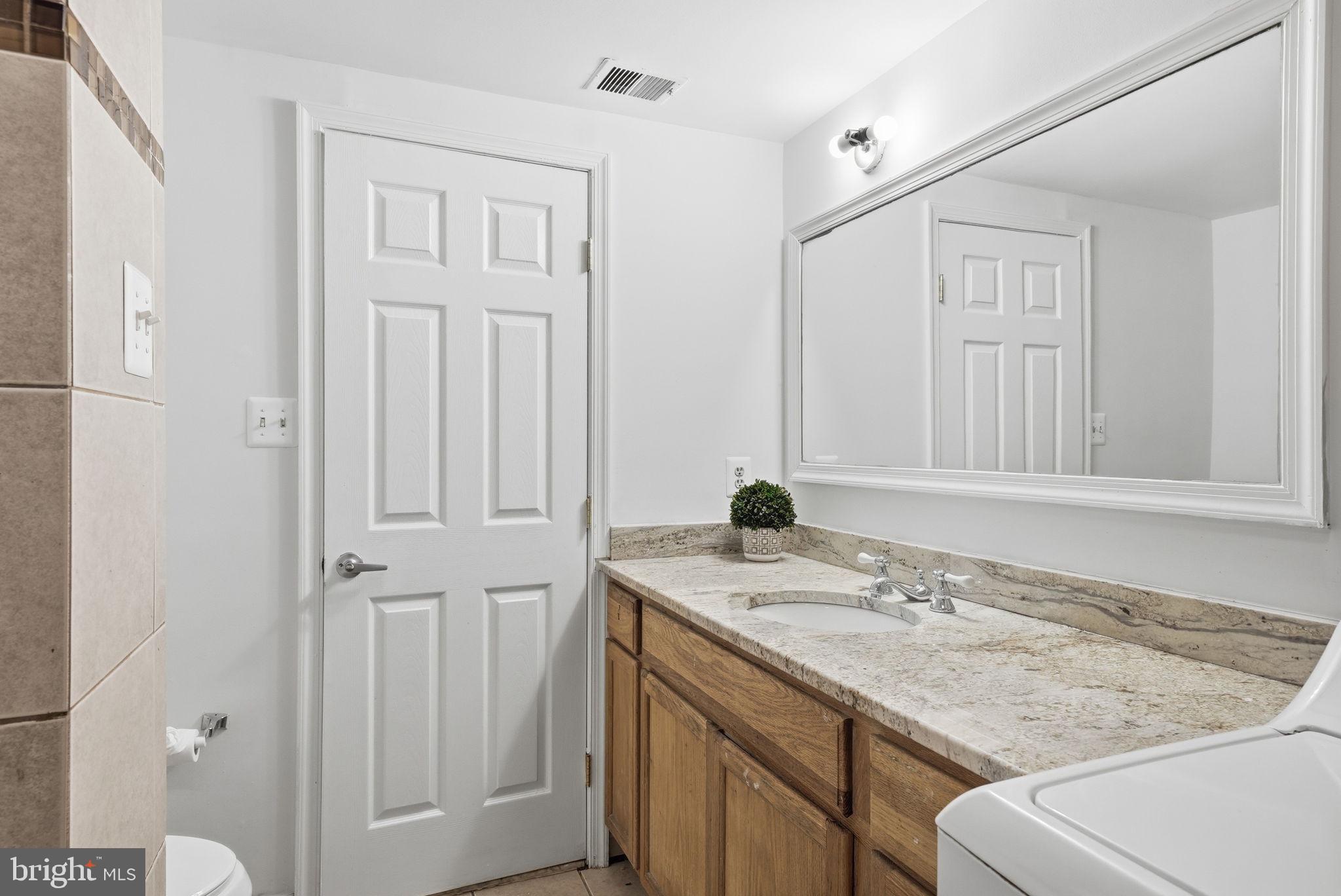 8074 Powderbrook Lane Springfield, VA 22153 - Photo 40 of 52 Granite counter in Lower Level full Bath.