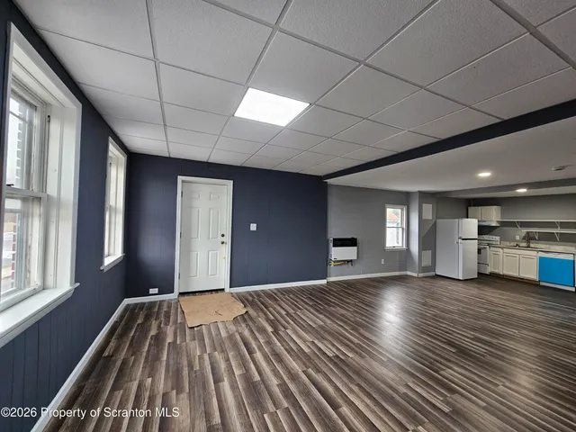 a view of a livingroom with a kitchen
