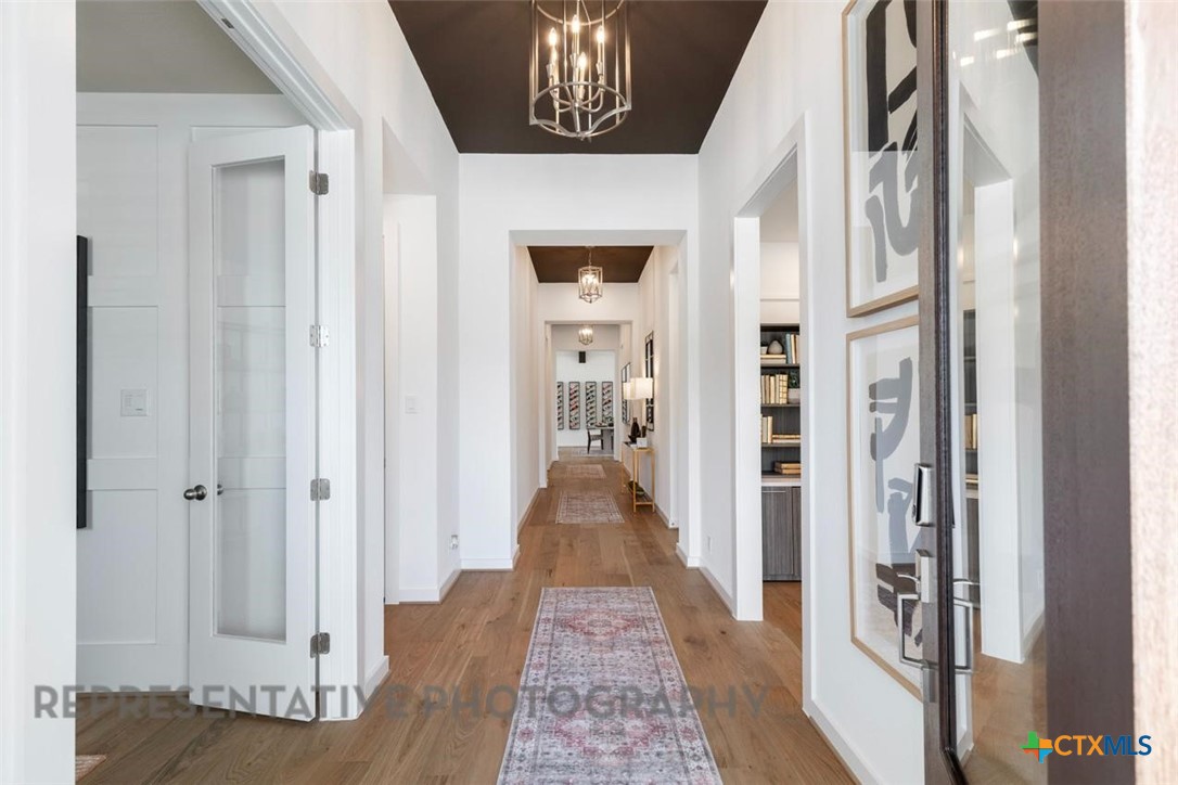 8084 Coral Draw Schertz, TX 78154 - Photo 6 of 13 a view of gallery with wooden floor