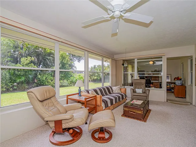 a bedroom with furniture and a book shelf