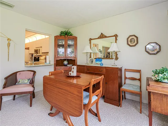 a kitchen with granite countertop a sink appliances and cabinets