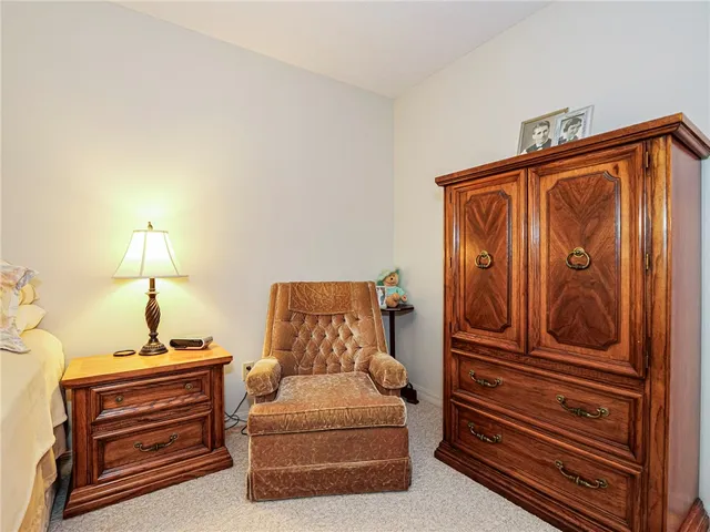 a bedroom with bed and window