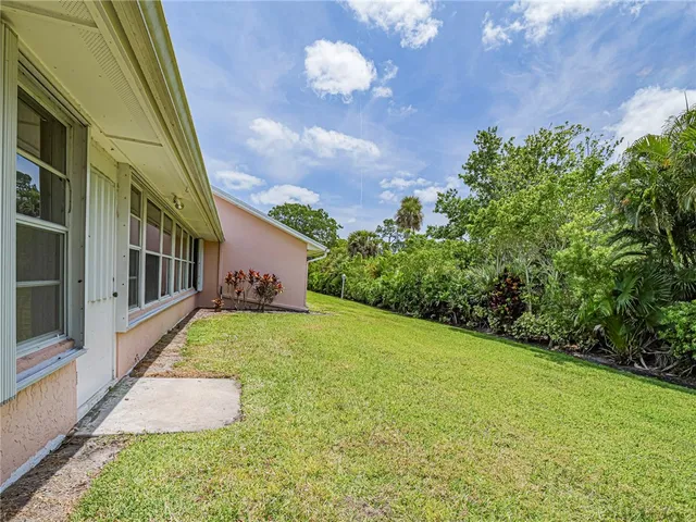 a view of a field with an trees