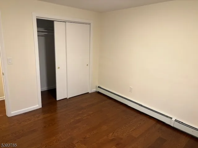 an empty room with wooden floor