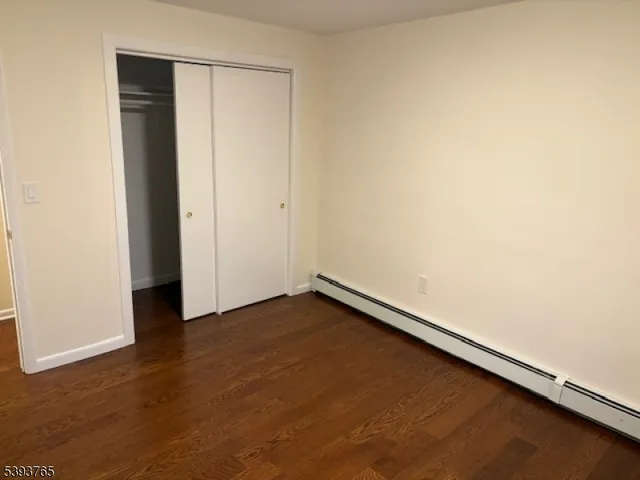 an empty room with wooden floor