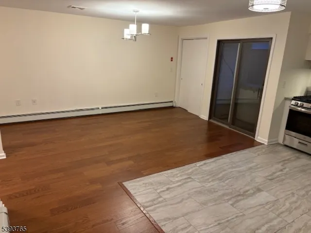 an empty room with wooden floor
