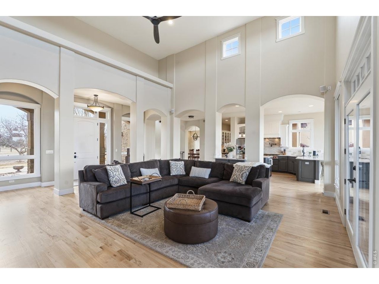 964 Riparian Way Fort Collins, CO 80524 - Photo 29 of 42 a living room with furniture and a chandelier