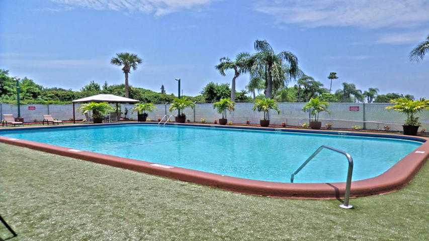 23 Crossings Circle, Unit E Boynton Beach, FL 33435 - Photo 12 of 15 a view of a backyard with a swimming pool