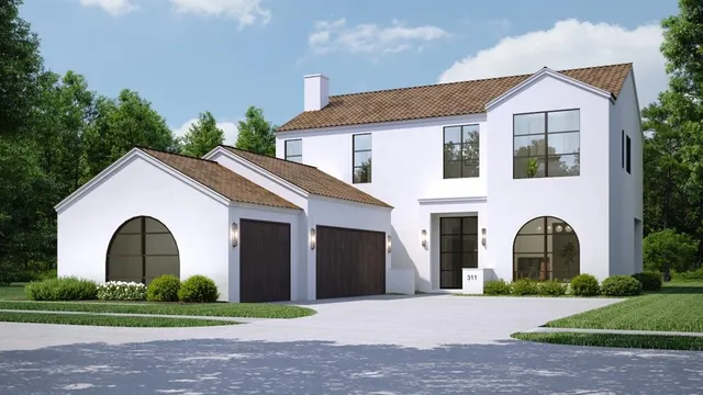 a front view of a house with a garden and plants