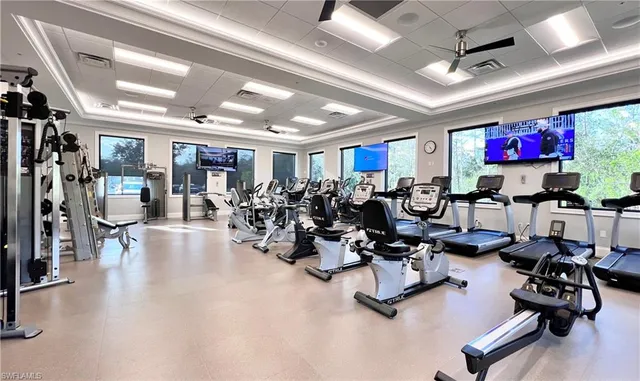 a gym room with lots of gym equipment