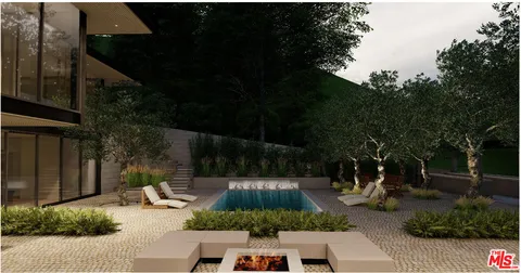 a view of a backyard with sitting area