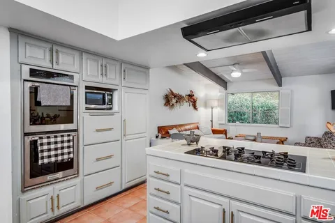 a kitchen with stainless steel appliances a stove and a refrigerator