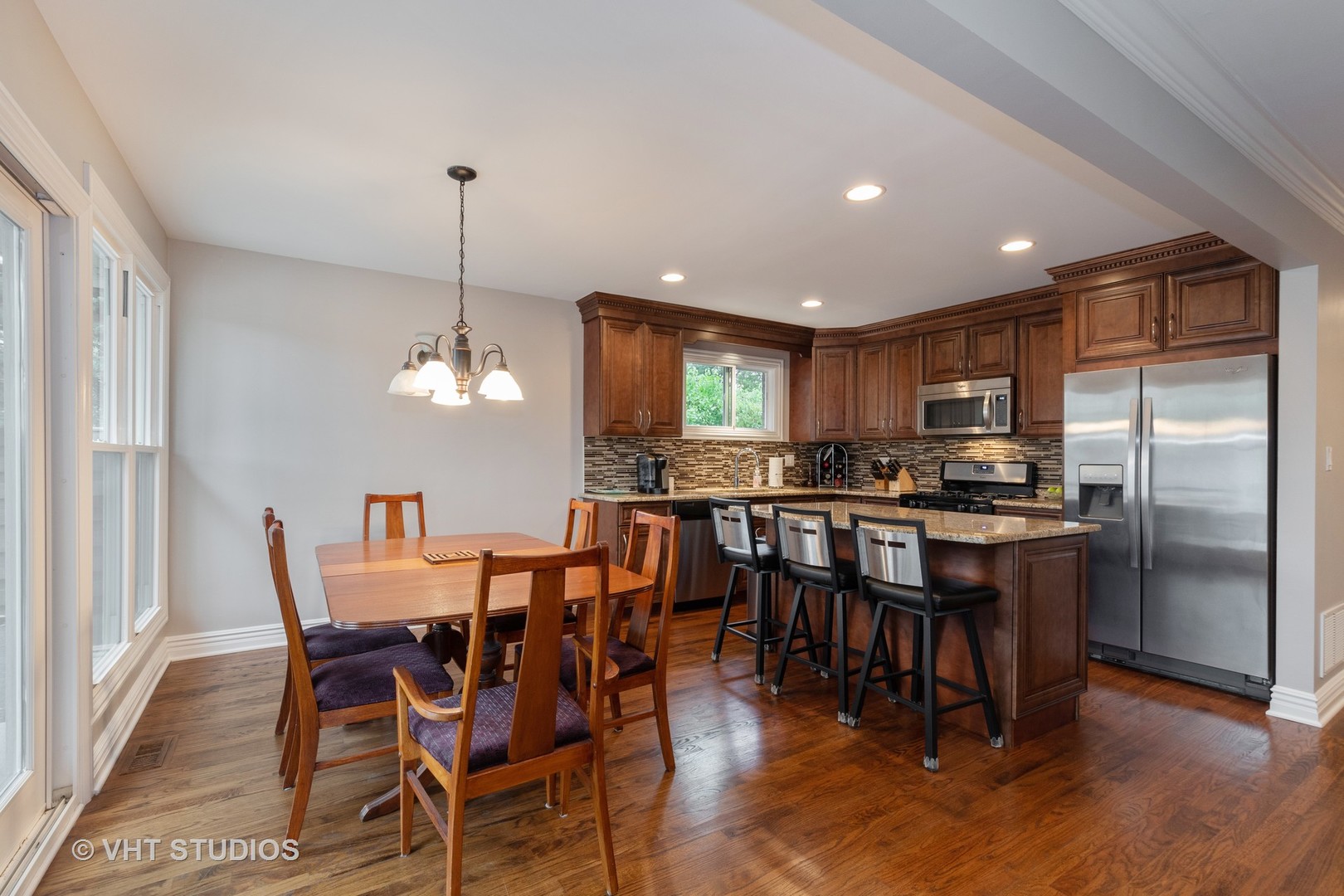 450 Sumac Road Highland Park, IL 60035 - Photo 3 of 12 a view of a dining room with furniture window and wooden floor