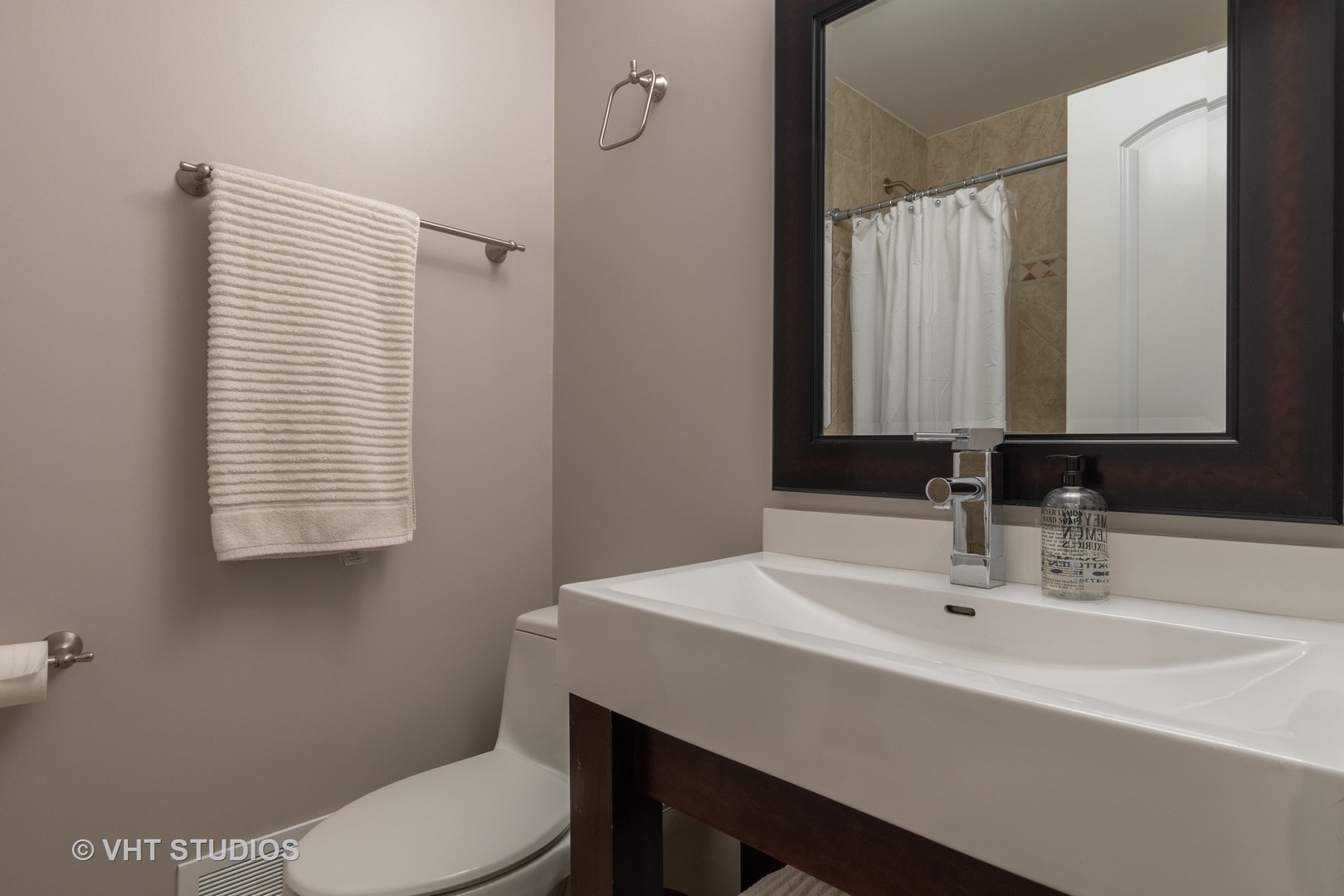 450 Sumac Road Highland Park, IL 60035 - Photo 8 of 12 a bathroom with a sink a toilet and mirror