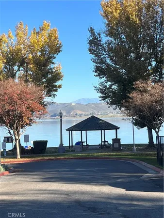 a view of house with backyard and tree
