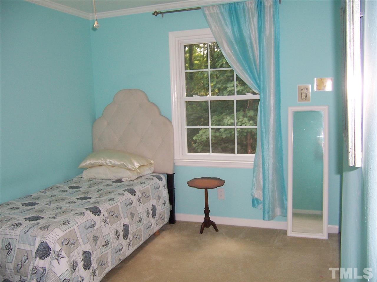 2834 Wycliff Road Raleigh, NC 27607 - Photo 14 of 25 a bedroom with a bed and a window