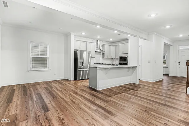 a view of kitchen with wooden floor