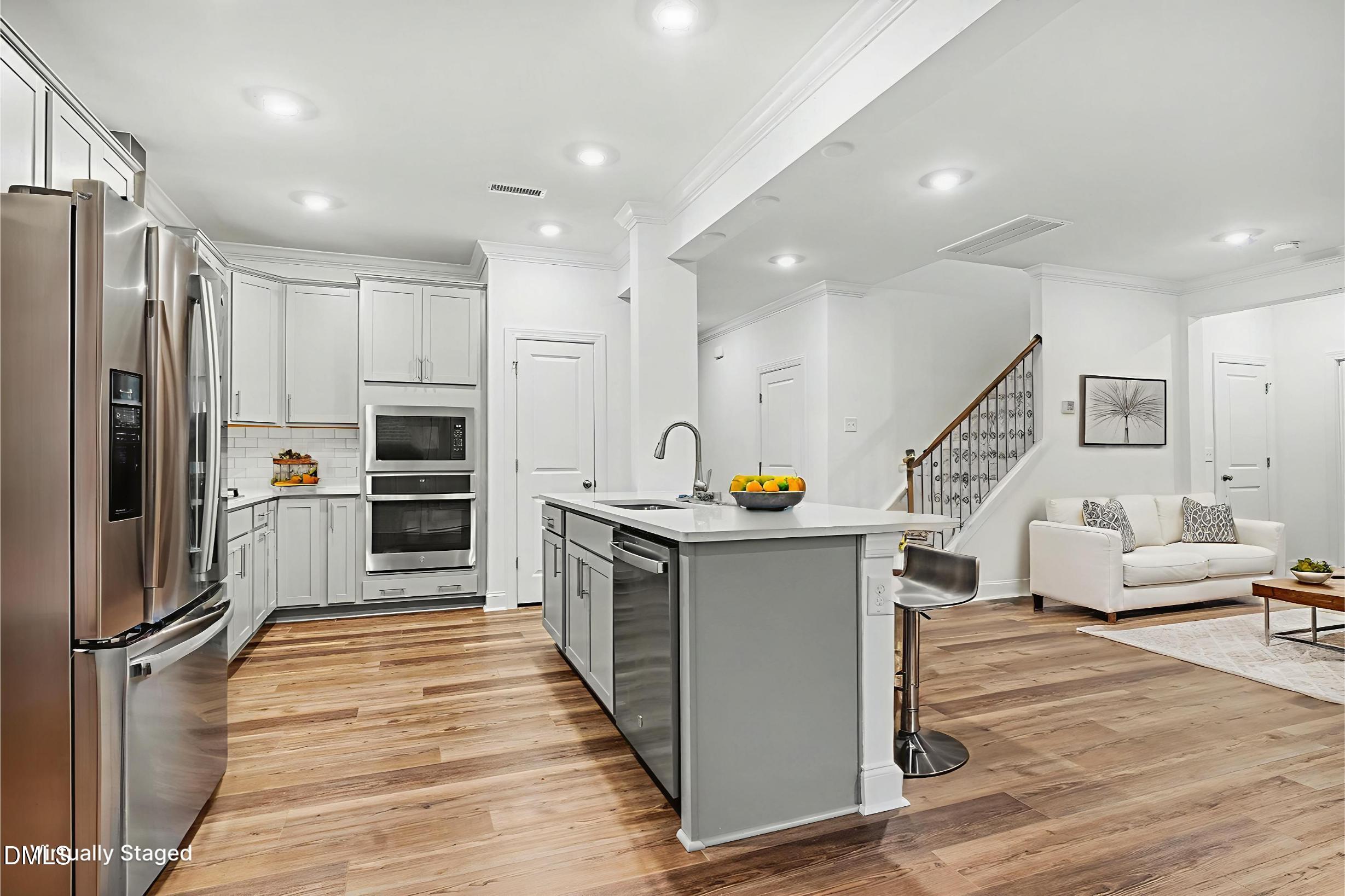 1328 Hazelnut Ridge Lane Knightdale, NC 27545 - Photo 15 of 50 a kitchen with stainless steel appliances a stove top oven and refrigerator